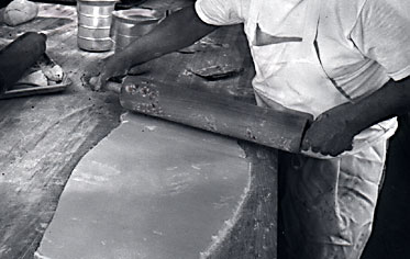 Rolling out the dough just like bakers did generations ago.