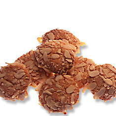Amaretti - soft chewy almond cookies topped with sliced peanuts.