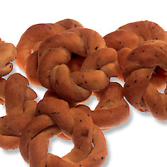 Taralli, or pepper biscuits, are savory braided biscuits flavored with black pepper and fennel seeds. Perfect with wine and cheese!