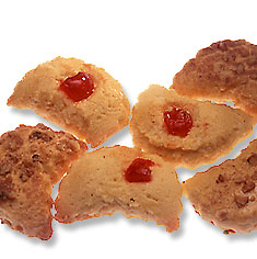 Crescents are half-moon shaped butter cookies sprinkled with walnuts and cinnamon or dotted with a cherry.